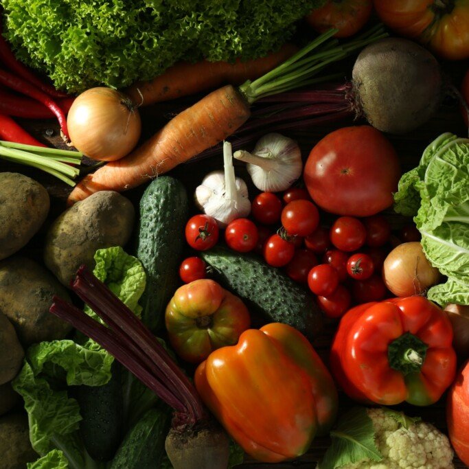 Different fresh ripe vegetables as background, top view. Farmer produce